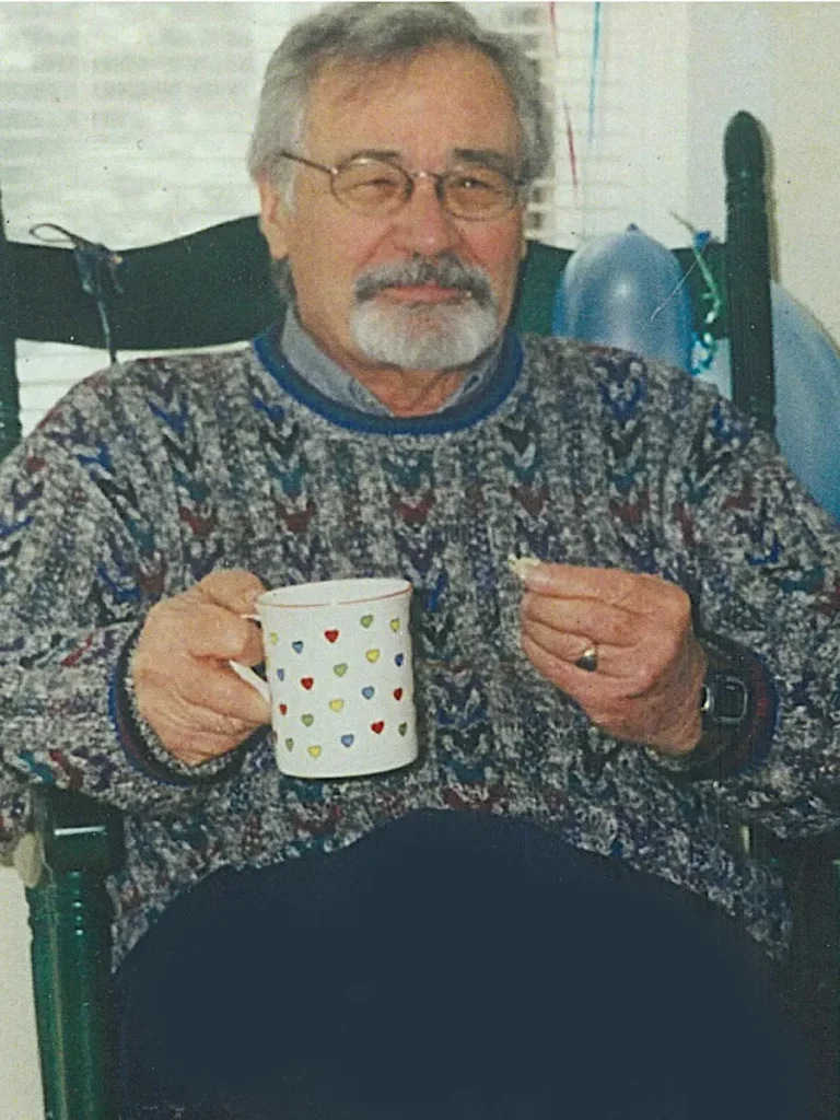 Creighton Brown relaxing in a rocking chair.